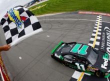 Denny Hamlin takes his fifth checkered flag in the last 10 NASCAR Sprint Cup Series races this season on Sunday at Michigan International Speedway in Brooklyn, Mich. Credit: Chris Trotman/Getty Images